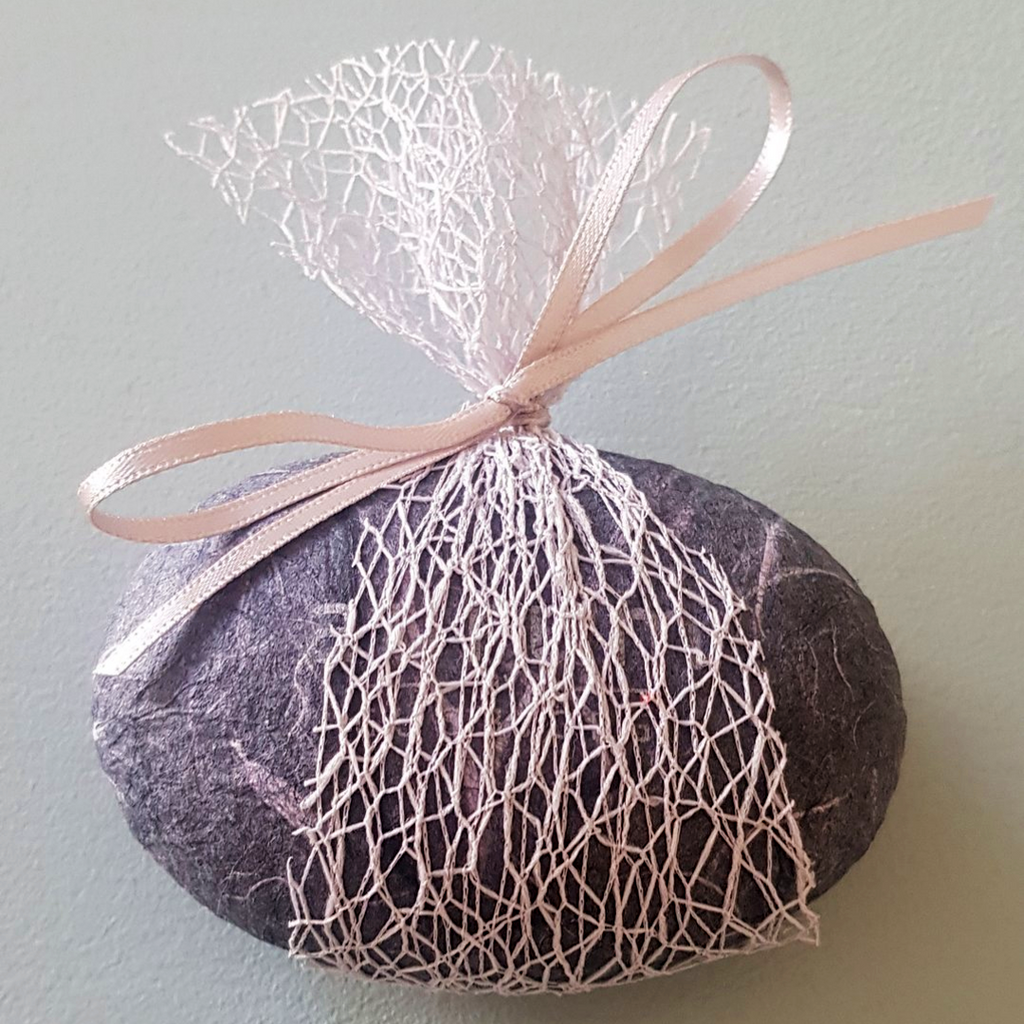 Our sustainable packaging made from mulberry tree fibre with outer ribbon